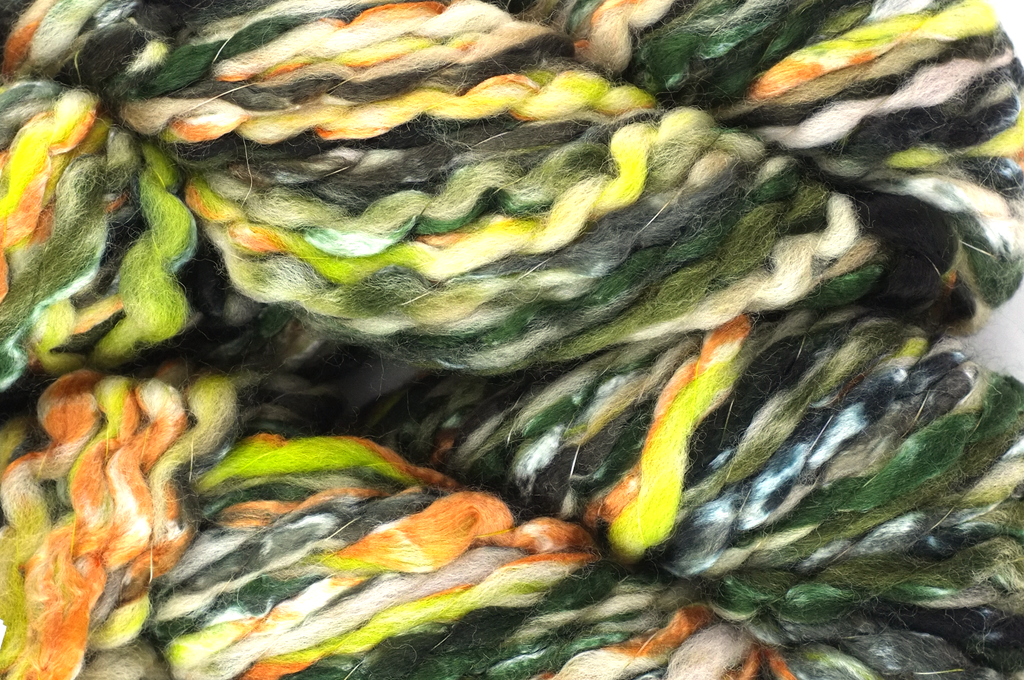 Super Bulky weight Enorme in Monolith 03, greens, black. orange, wool blend yarn by Louisa Harding